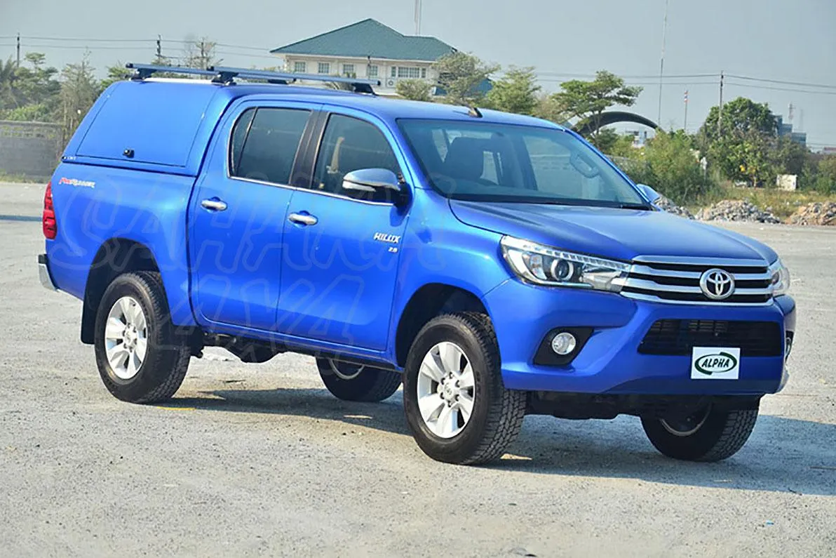 HARDTOP ALPHA CMX EN FIBRA, CON PORTONES LATERALES ELEVABLES PARA TOYOTA HILUX ''REVO'' 2016