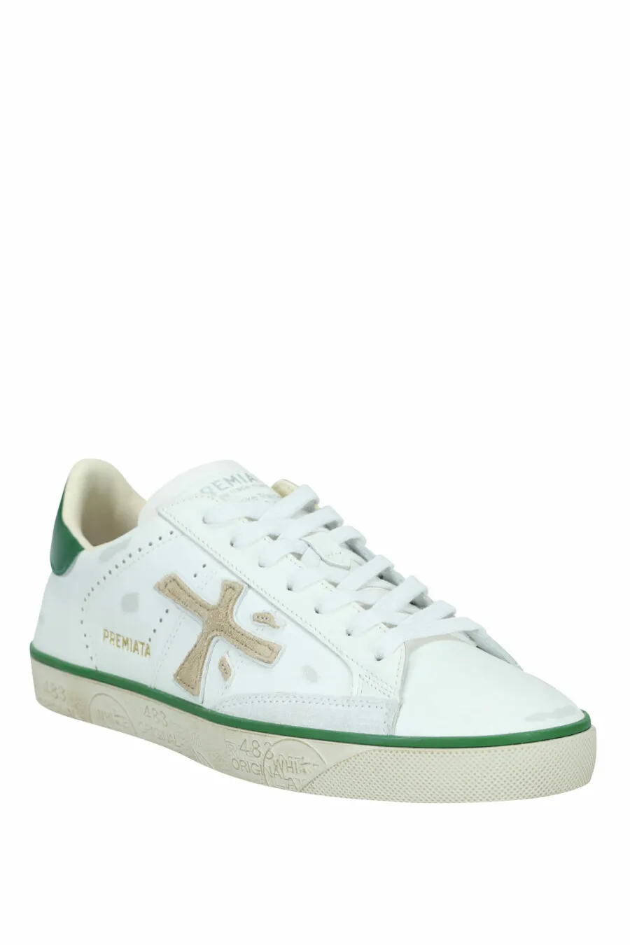 Zapatillas blancas desgastadas con verde 